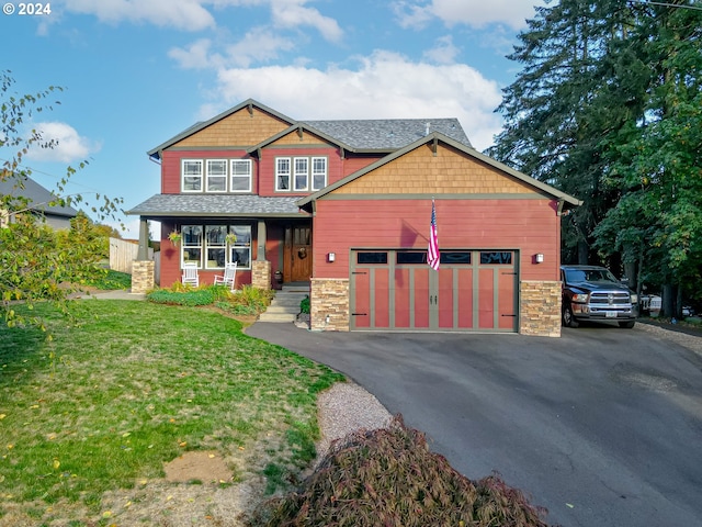 craftsman inspired home with a front lawn and a porch