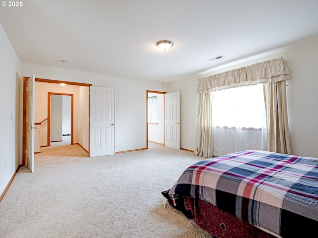 bedroom featuring carpet, visible vents, and baseboards