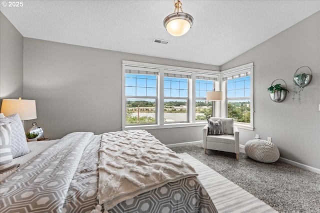 9183 NW Germantown Rd, Portland, OR 97231 - bedroom featuring carpet floors, baseboards, lofted ceiling, and a textured ceiling