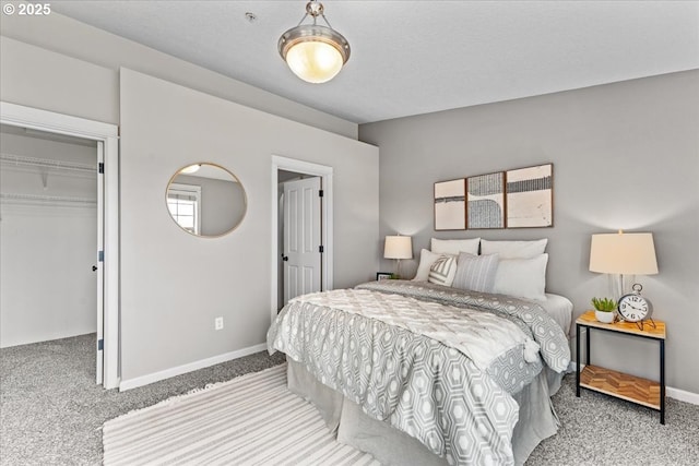 9183 NW Germantown Rd, Portland, OR 97231 - carpeted bedroom featuring a spacious closet, baseboards, and a closet