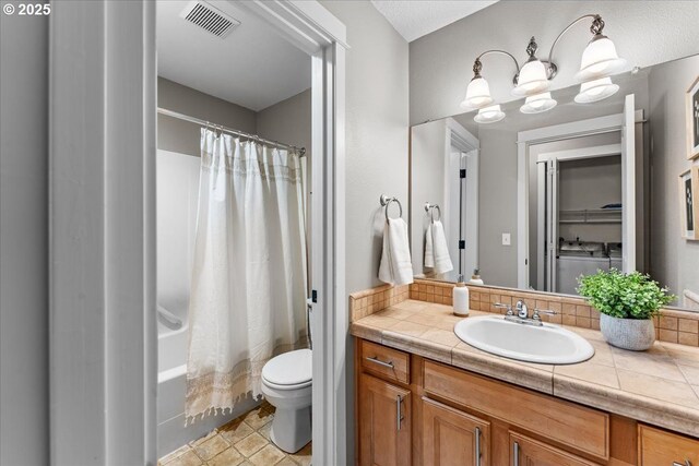 9183 NW Germantown Rd, Portland, OR 97231 - bathroom featuring toilet, vanity, a chandelier, and shower / tub combo with curtain