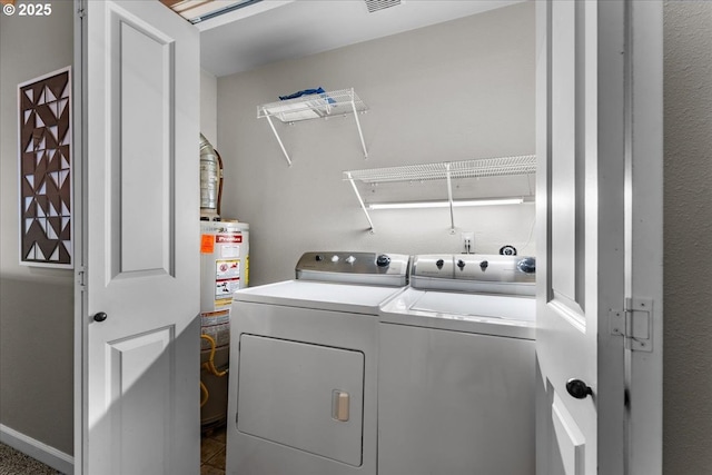 9183 NW Germantown Rd, Portland, OR 97231 - laundry room featuring independent washer and dryer and gas water heater
