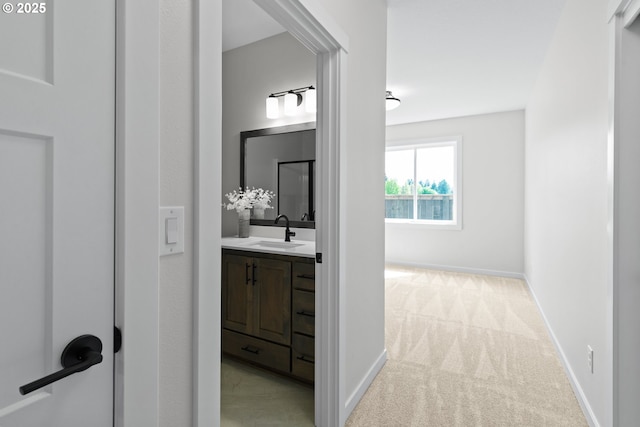 bathroom with vanity and baseboards