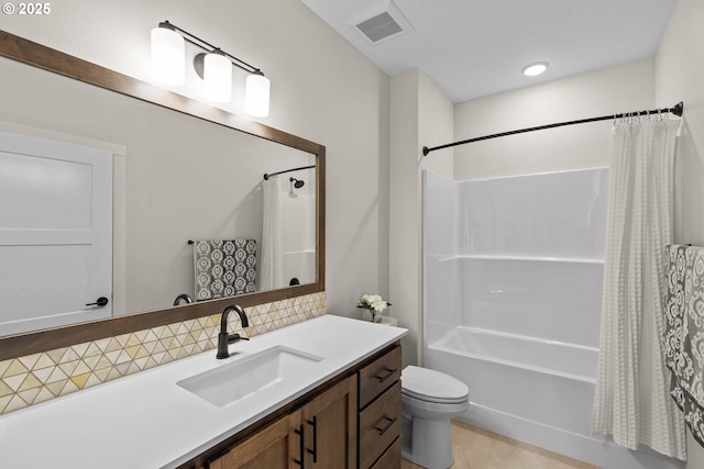 full bath with vanity, toilet, backsplash, visible vents, and shower / bath combo