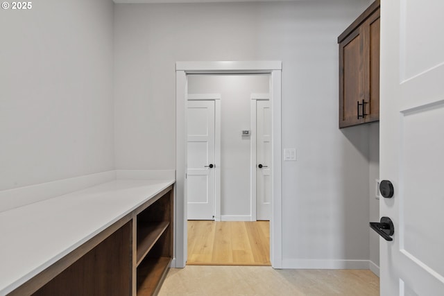 interior space with light wood-style flooring and baseboards