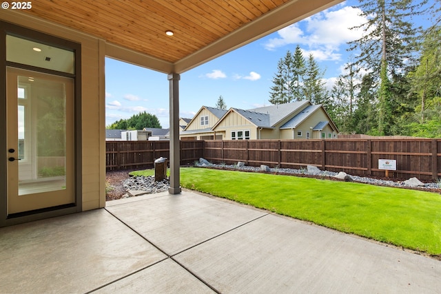 view of patio / terrace featuring a residential view and fence private yard