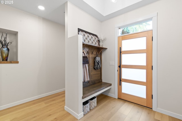 mudroom featuring baseboards, wood finished floors, and recessed lighting