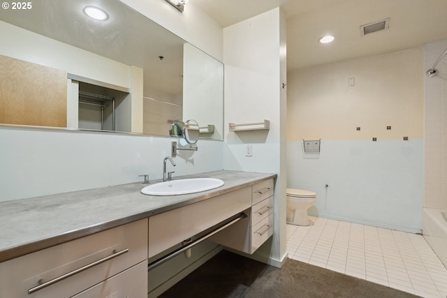 bathroom featuring vanity, recessed lighting, tile patterned flooring, toilet, and washtub / shower combination
