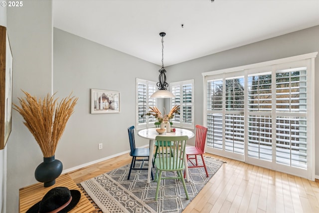 dining room featuring wood finished floors and baseboards