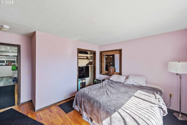 1366 Lakeshore Dr, Coos Bay, OR 97420 - bedroom with light wood-style floors, baseboards, and a closet
