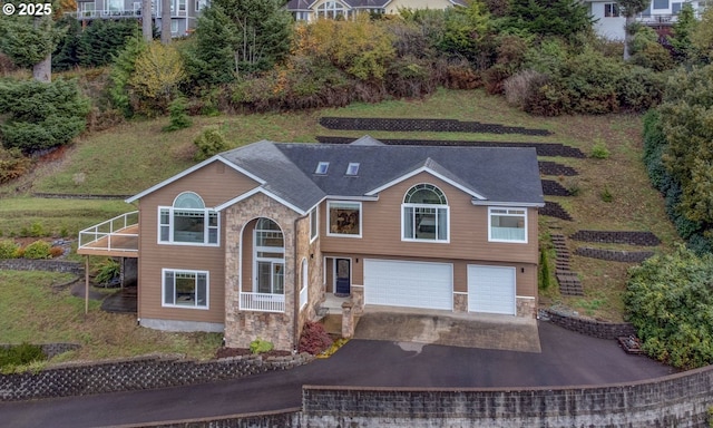 view of front of house with a garage and concrete driveway