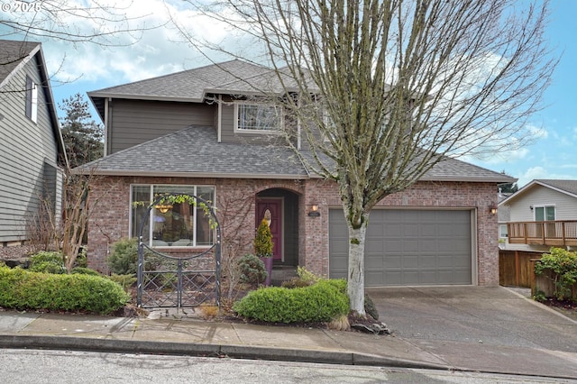 traditional-style house with a garage, driveway, brick siding, and roof with shingles