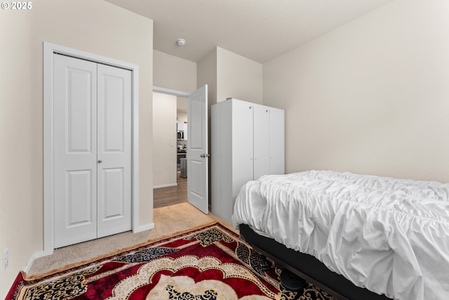 carpeted bedroom with a closet