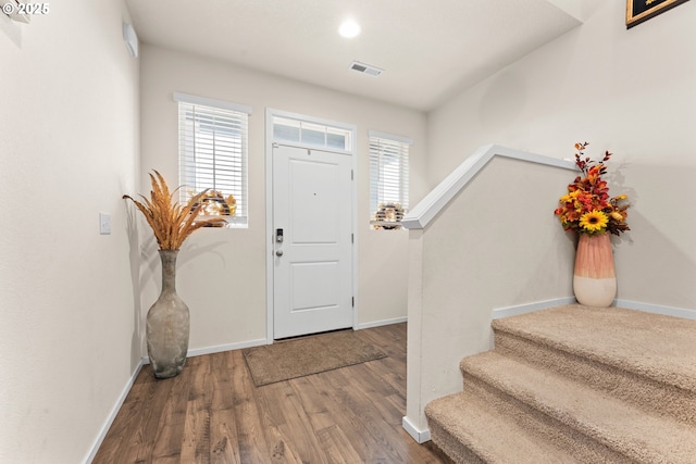 foyer featuring hardwood / wood-style flooring and a wealth of natural light