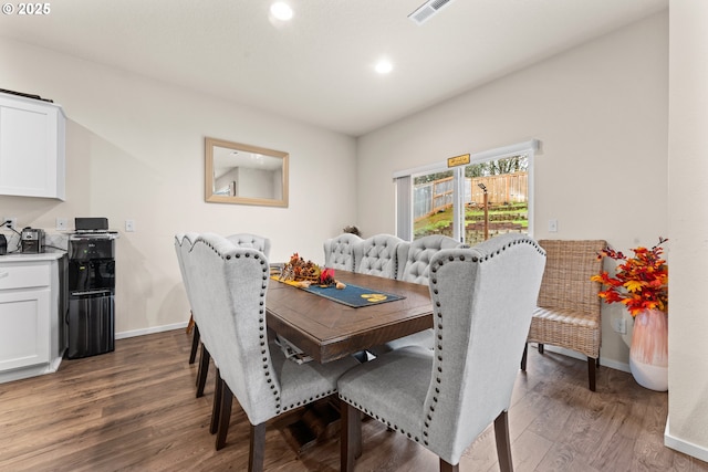 dining space featuring dark wood-type flooring