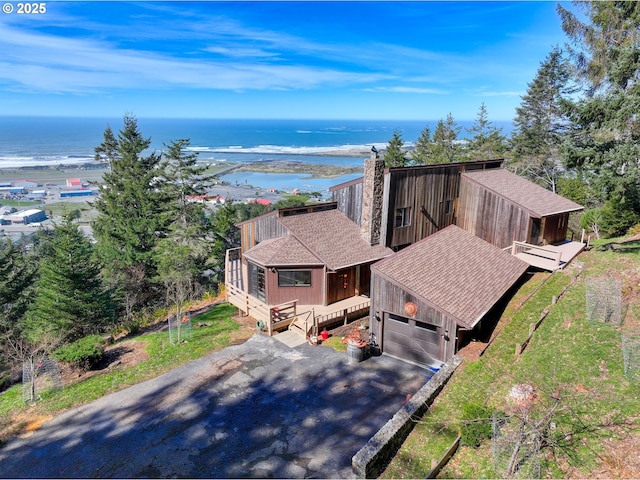 birds eye view of property featuring a water view