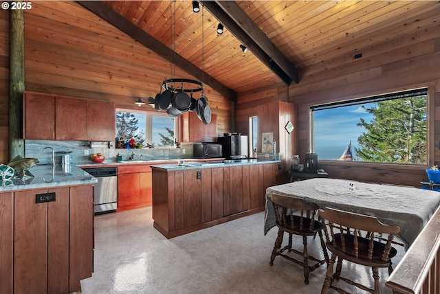 29844 Hound Dog Rd, Gold Beach, OR 97444 - kitchen with stainless steel dishwasher, brown cabinets, wood walls, wood ceiling, and light countertops
