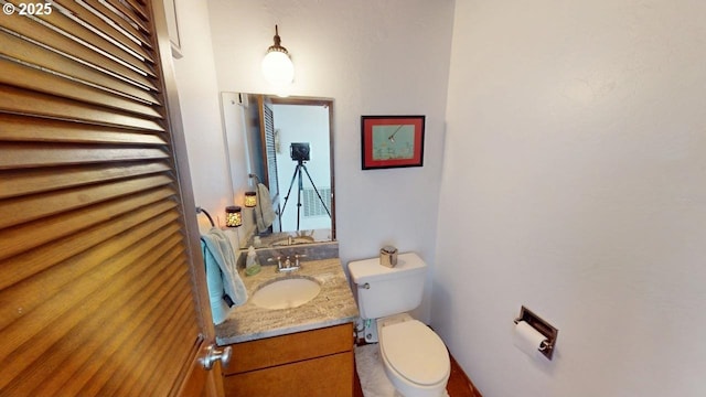29844 Hound Dog Rd, Gold Beach, OR 97444 - bathroom with toilet and vanity
