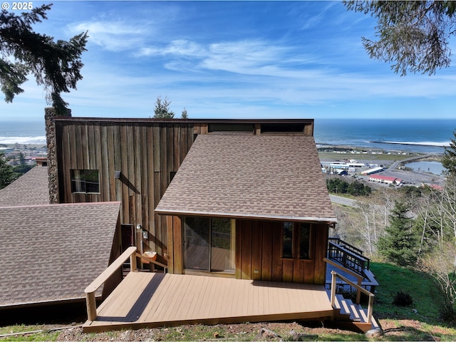 29844 Hound Dog Rd, Gold Beach, OR 97444 - back of house featuring a shingled roof and a deck with water view