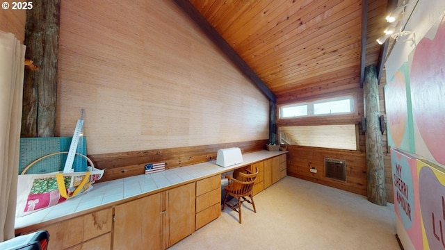 29844 Hound Dog Rd, Gold Beach, OR 97444 - office area with wooden ceiling, light carpet, vaulted ceiling, wooden walls, and built in desk