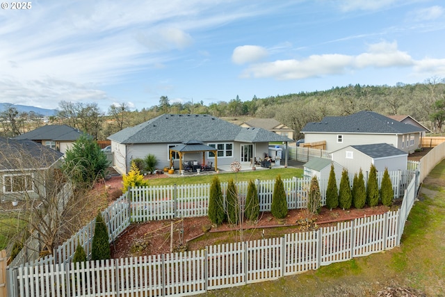 back of house featuring a patio area and a gazebo