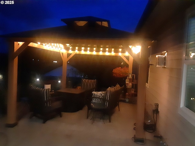 patio at twilight with an outdoor living space