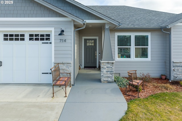 doorway to property with a garage