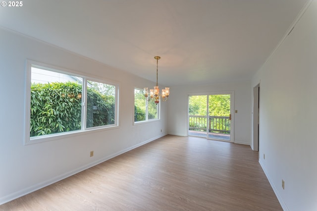 725 N 9th St, Coos Bay, OR 97420 - empty room with a chandelier, wood finished floors, and baseboards