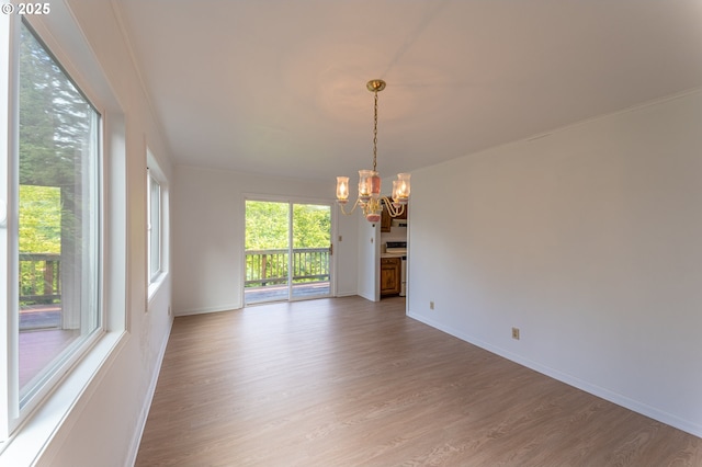 725 N 9th St, Coos Bay, OR 97420 - empty room with a chandelier, wood finished floors, and baseboards