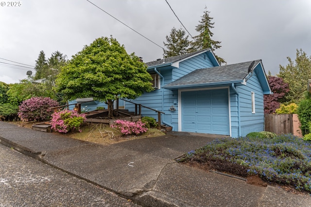 725 N 9th St, Coos Bay, OR 97420 - view of front of home featuring asphalt driveway and a garage