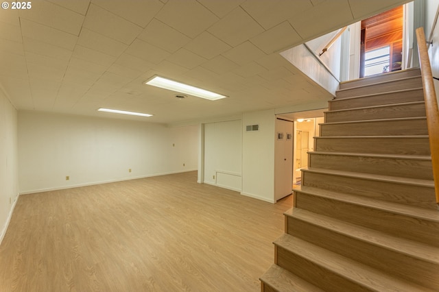 725 N 9th St, Coos Bay, OR 97420 - basement with stairs, light wood-style flooring, and baseboards