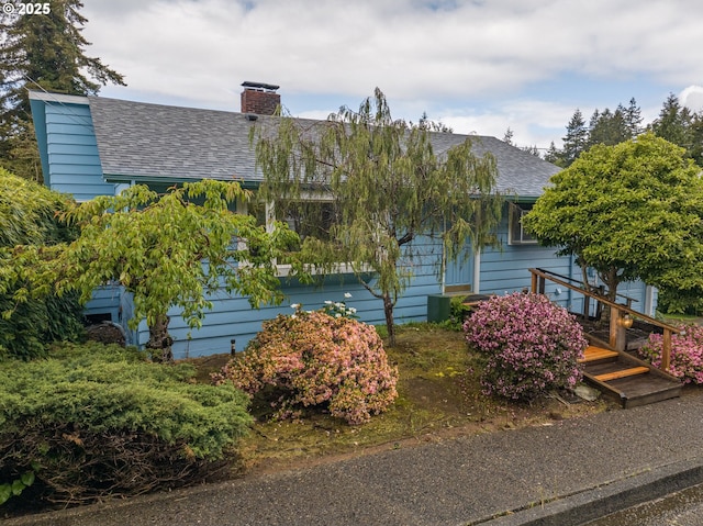 725 N 9th St, Coos Bay, OR 97420 - view of front of house featuring roof with shingles and a chimney