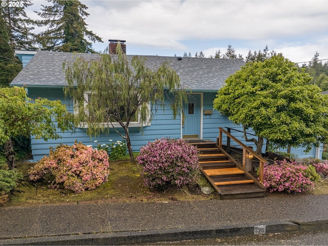 725 N 9th St, Coos Bay, OR 97420 - view of front of property with a shingled roof and a chimney