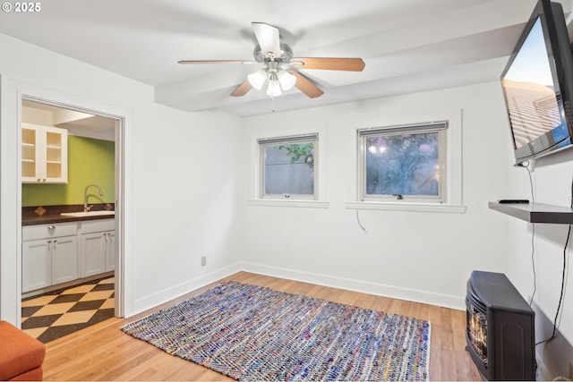 1529 SE Hawthorne Blvd Unit 2, Portland, OR 97214 - interior space featuring light wood finished floors, a sink, a ceiling fan, and baseboards