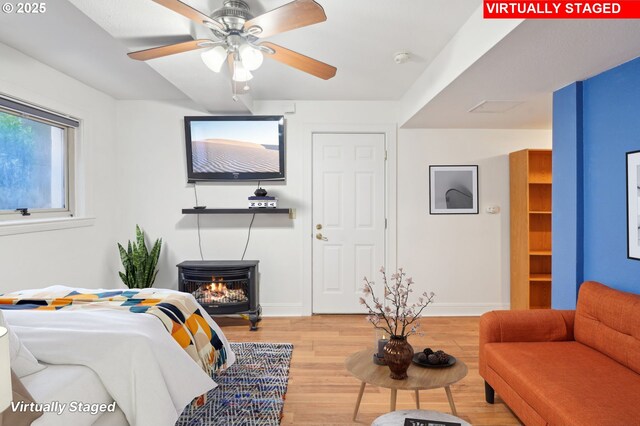 1529 SE Hawthorne Blvd Unit 2, Portland, OR 97214 - bedroom featuring light wood-style floors, baseboards, and ceiling fan