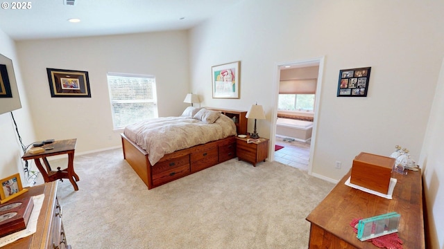 94342 Gauntlett St, Gold Beach, OR 97444 - bedroom featuring light colored carpet, vaulted ceiling, recessed lighting, and connected bathroom