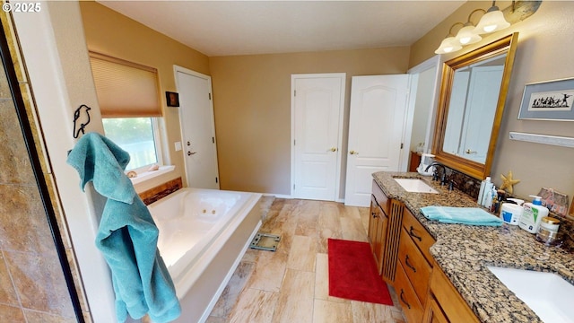 94342 Gauntlett St, Gold Beach, OR 97444 - bathroom with double vanity, a bath, and wood finished floors