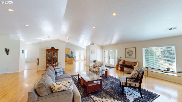 94342 Gauntlett St, Gold Beach, OR 97444 - living area with light wood-style floors, lofted ceiling, recessed lighting, and french doors