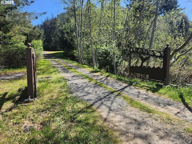 94342 Gauntlett St, Gold Beach, OR 97444 - view of dirt / gravel road with a wooded view