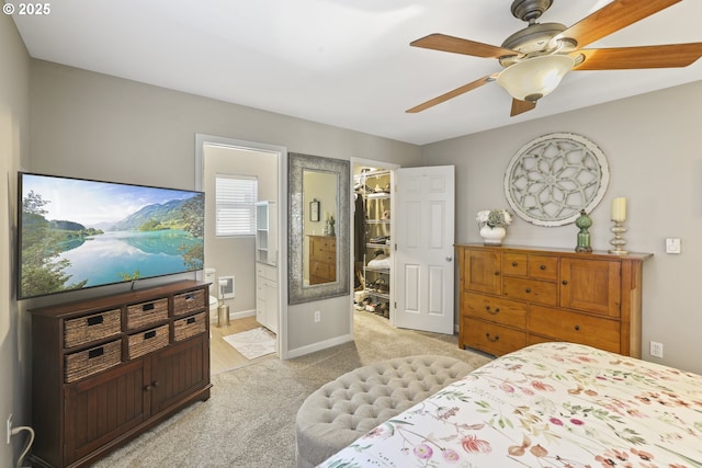 50990 Dike Rd Unit B3, Scappoose, OR 97056 - bedroom featuring a walk in closet, light colored carpet, ensuite bath, a closet, and baseboards