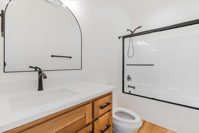 1081 SE Balsamroot Ln, Madras, OR 97741 - full bathroom with vanity, shower / washtub combination, and wood finished floors