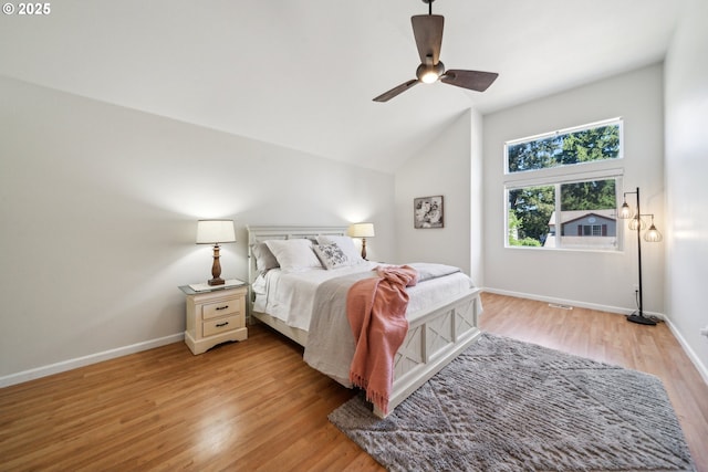23295 SW Cascade Pl, Sherwood, OR 97140 - bedroom with light wood-type flooring, baseboards, lofted ceiling, and ceiling fan