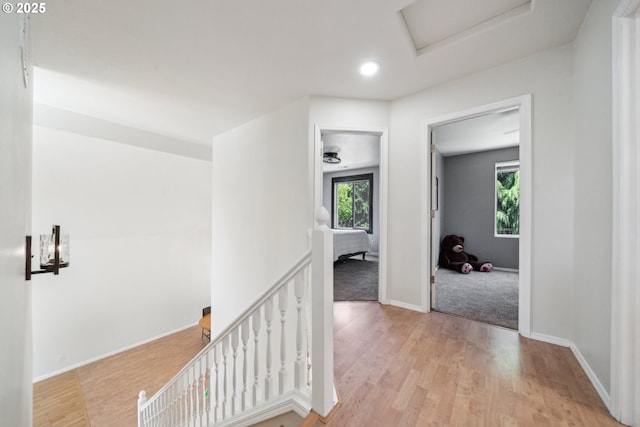 23295 SW Cascade Pl, Sherwood, OR 97140 - hall featuring an upstairs landing, wood finished floors, recessed lighting, baseboards, and attic access