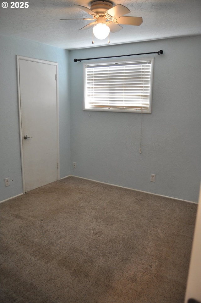 25821 Jeans Rd, Veneta, OR 97487 - carpeted empty room with a ceiling fan and a textured ceiling
