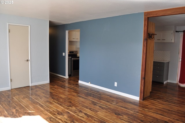 25821 Jeans Rd, Veneta, OR 97487 - unfurnished bedroom featuring dark wood-type flooring and baseboards