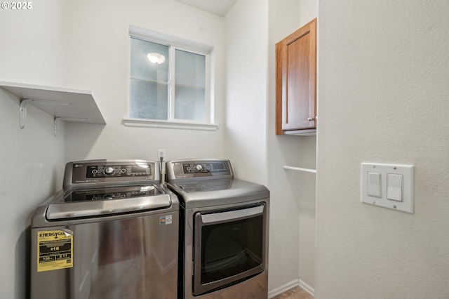 clothes washing area featuring laundry area and washing machine and clothes dryer