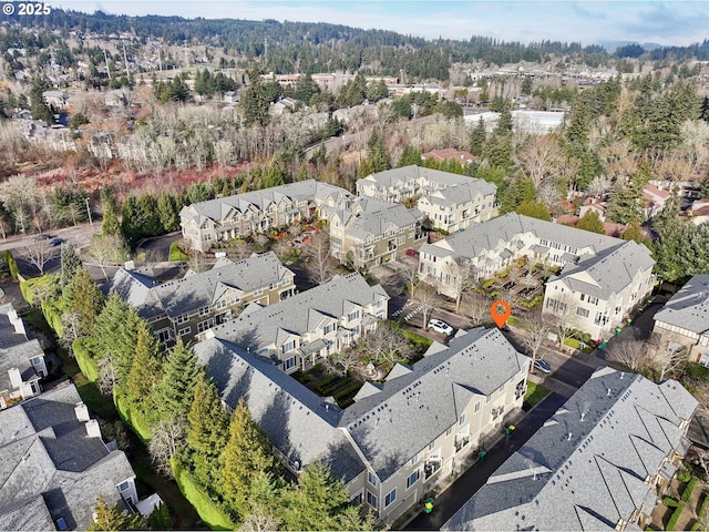 birds eye view of property with a residential view