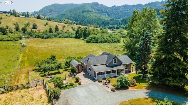 96863 Sitkum Ln, Myrtle Point, OR 97458 - aerial view of sparsely populated area featuring a mountain backdrop and a heavily wooded area
