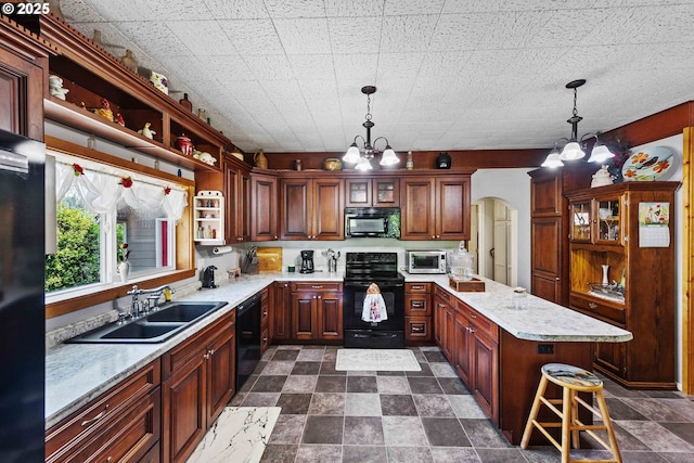 96863 Sitkum Ln, Myrtle Point, OR 97458 - kitchen featuring black appliances, a chandelier, open shelves, hanging light fixtures, and arched walkways