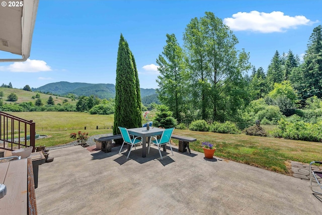 96863 Sitkum Ln, Myrtle Point, OR 97458 - view of patio / terrace with a mountain view and outdoor dining area